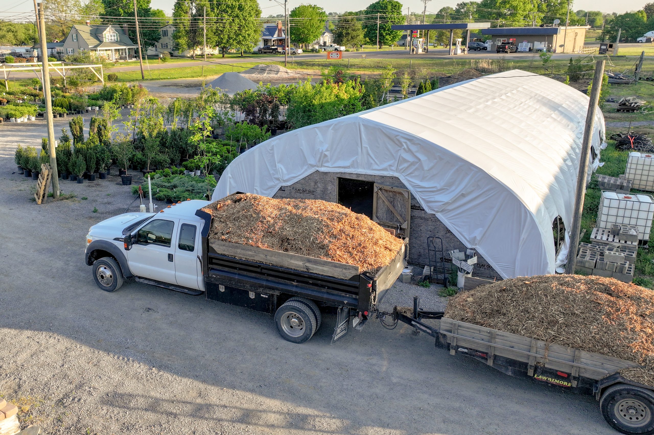Packs nursery truck hauling mulch.